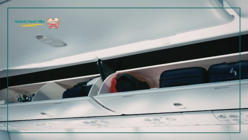 airplane overhead storage. secure loose items. flying with an infant on lap