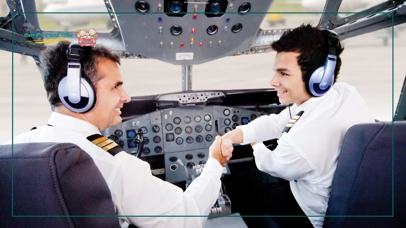 commercial pilots looking at each other smiling and shaking hands. biggest reason Why Is It Safe to Fly in the Rain