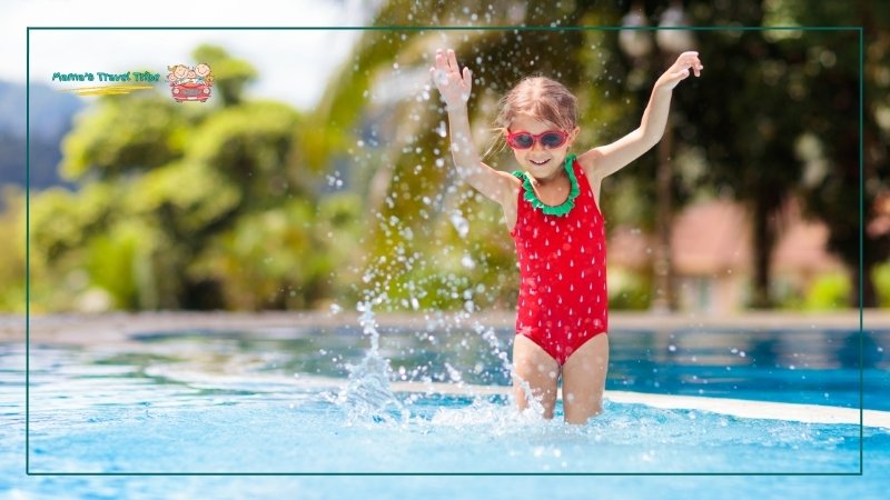 Family-Friendly Resorts, child in a resort splashing water. places to go with 2 year olds