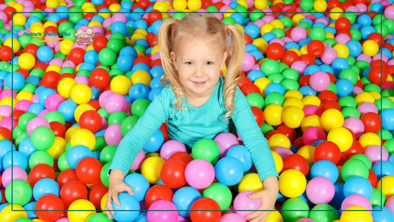 Indoor Play Centers, child in a ball pit