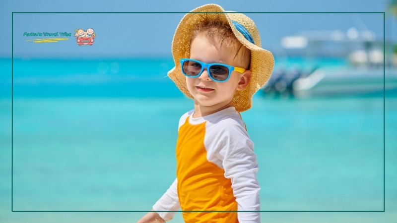 toddler with a sunhat and sunglasses. toddler beach essentials