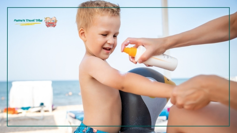 adult applying sunscreen to a toddler. toddler beach essentials