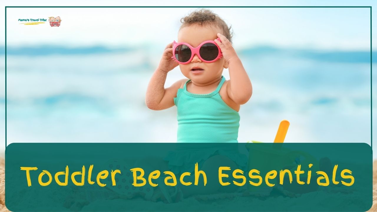 toddler on a beach holding sunglasses. toddler beach essentials