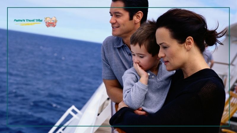 Family of three on cruise. mom dad and baby looking at the water from the edge of a cruise ship. do babies need passport to go on cruise