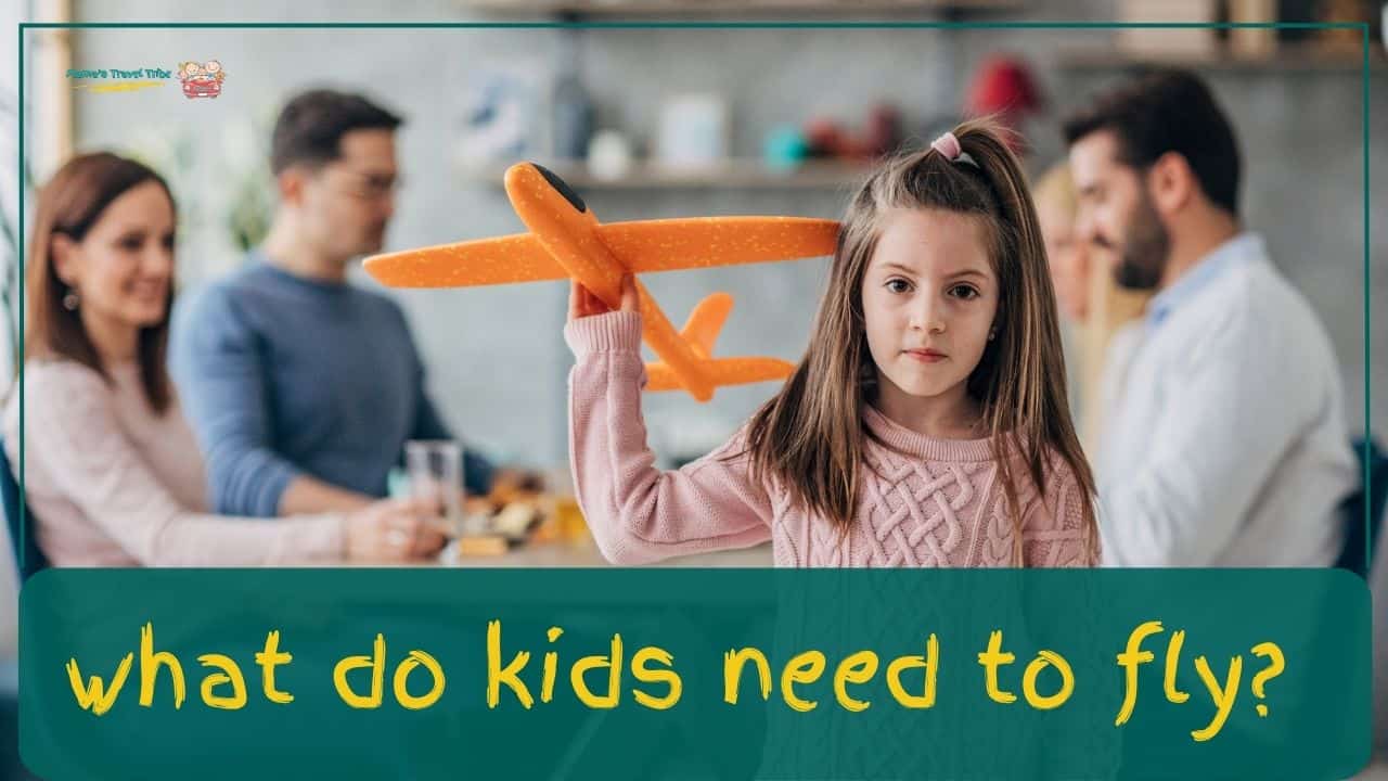 child holding an airplane toy and pretending to fly it while three adults on the table discuss something. what do kids need to fly.